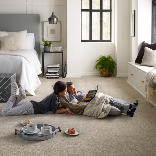 Kids sitting on carpeted floor