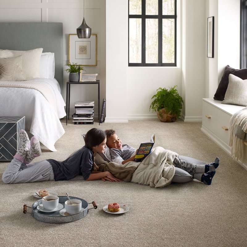 Kids sitting on carpeted floor